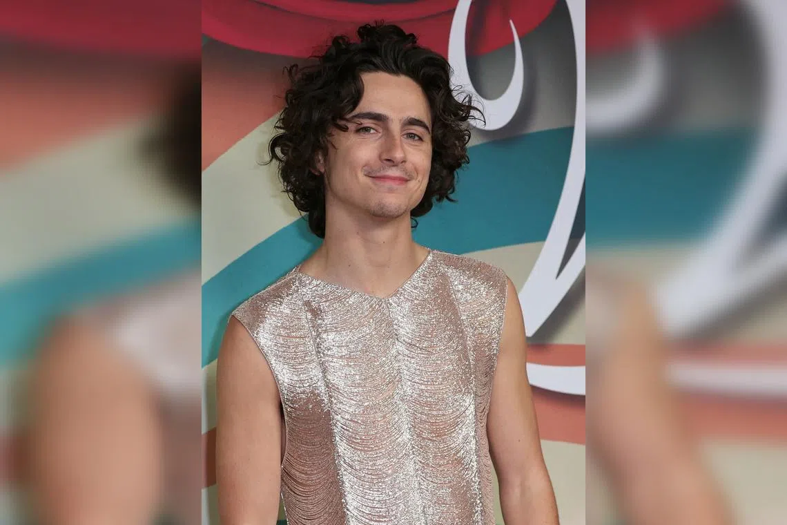 Actor Timothee Chalamet wore a shimmery, beaded top from Tom Ford’s 2024 women’s Spring/Summer collection at a movie premiere in Paris.