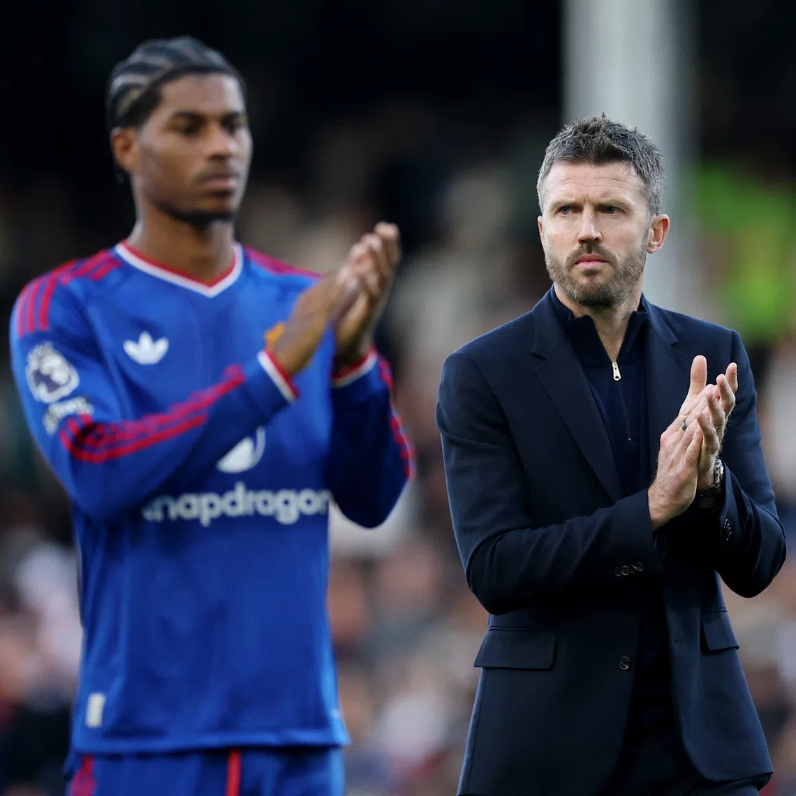 Manchester United manager Michael Carrick applauds fans after his side avoided another defeat with a 1-1 draw at Fulham.