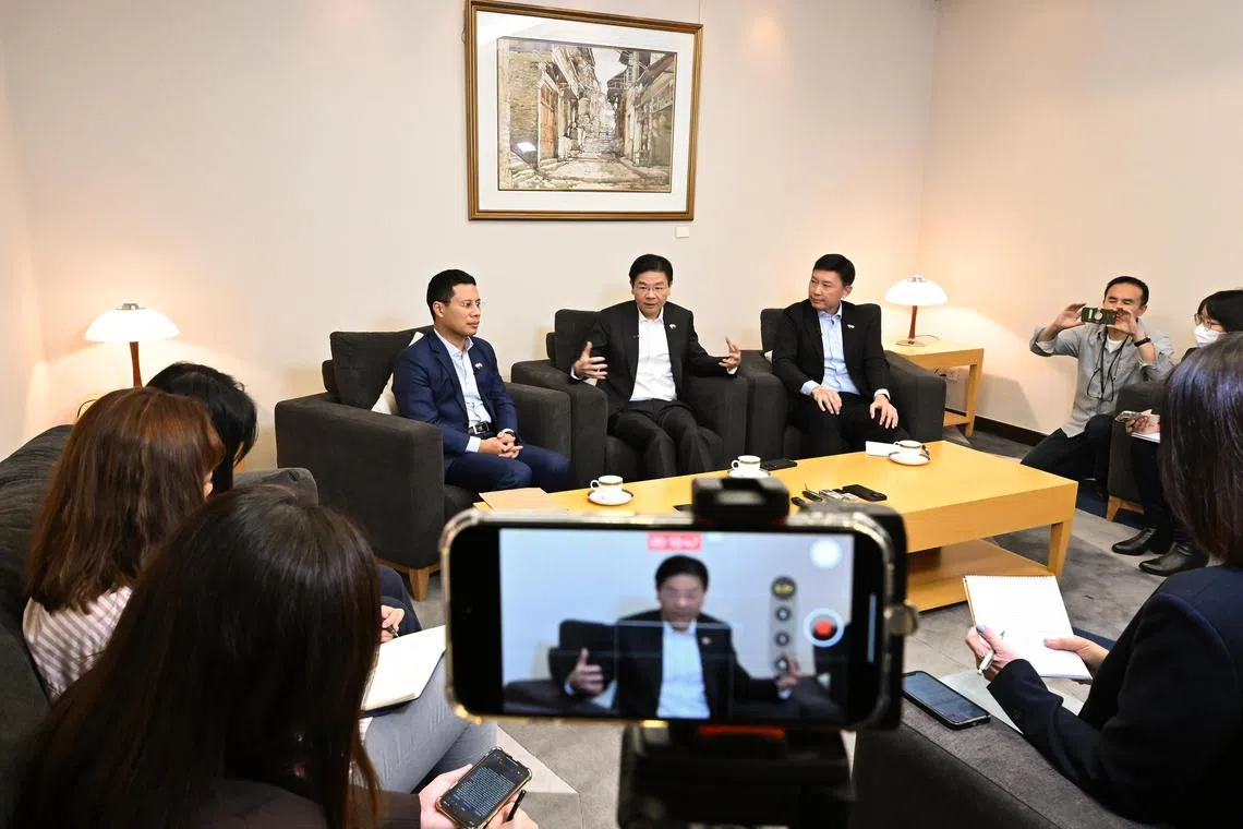 ST20231208-202390288095-Lim Yaohui-Elizabeth Law-elwrap/
Deputy Prime Minister Lawrence Wong, together with Mr Desmond Lee, Minister for National Development; and Acting Minister for Transport and Senior Minister of State (Finance) Chee Hong Tat, having media doorstop with Singapore media at Singapore Embassy in Beijing on Dec 8, 2023.
(ST PHOTO: LIM YAOHUI)