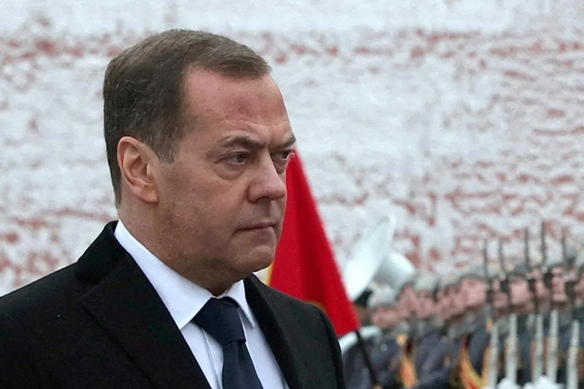 FILE PHOTO: Russia's deputy Security Council chief Dmitry Medvedev takes part in a wreath-laying ceremony marking Defender of the Fatherland Day at the Tomb of the Unknown Soldier by the Kremlin Wall in Moscow, Russia, February 23, 2024. Sputnik/Yekaterina Shtukina/Pool via REUTERS ATTENTION EDITORS - THIS IMAGE WAS PROVIDED BY A THIRD PARTY/File Photo