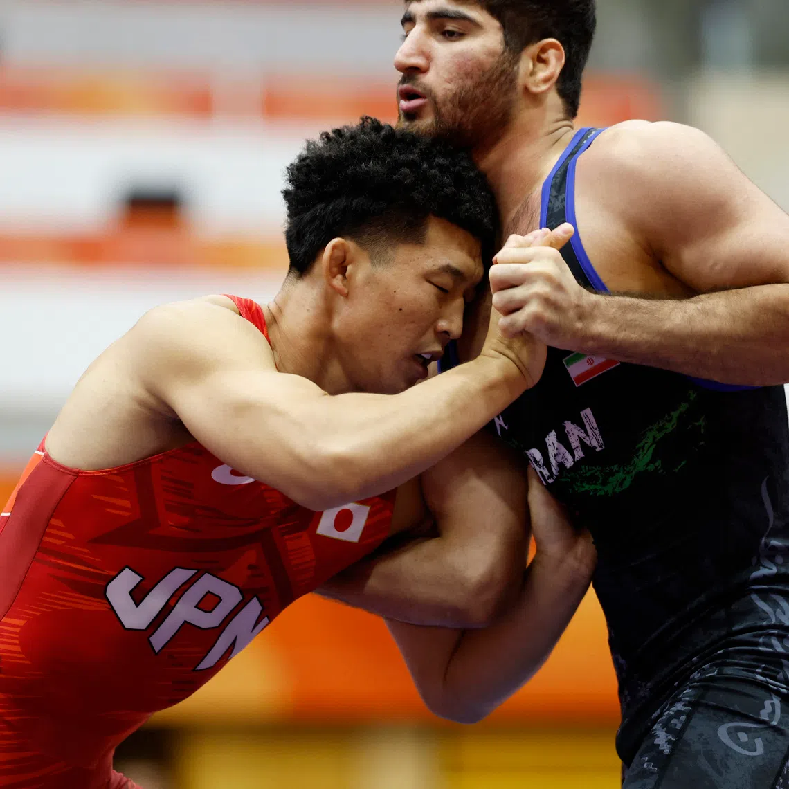 Asian Games - Aichi-Nagoya 2026 - Wrestling - Inae Sports Center, Nagoya, Japan - October 1, 2026 Iran's Alireza Abdevali in action during the men's greco-roman 77kg gold medal match against Japan's Nao Kusaka REUTERS/Eloisa Lopez
