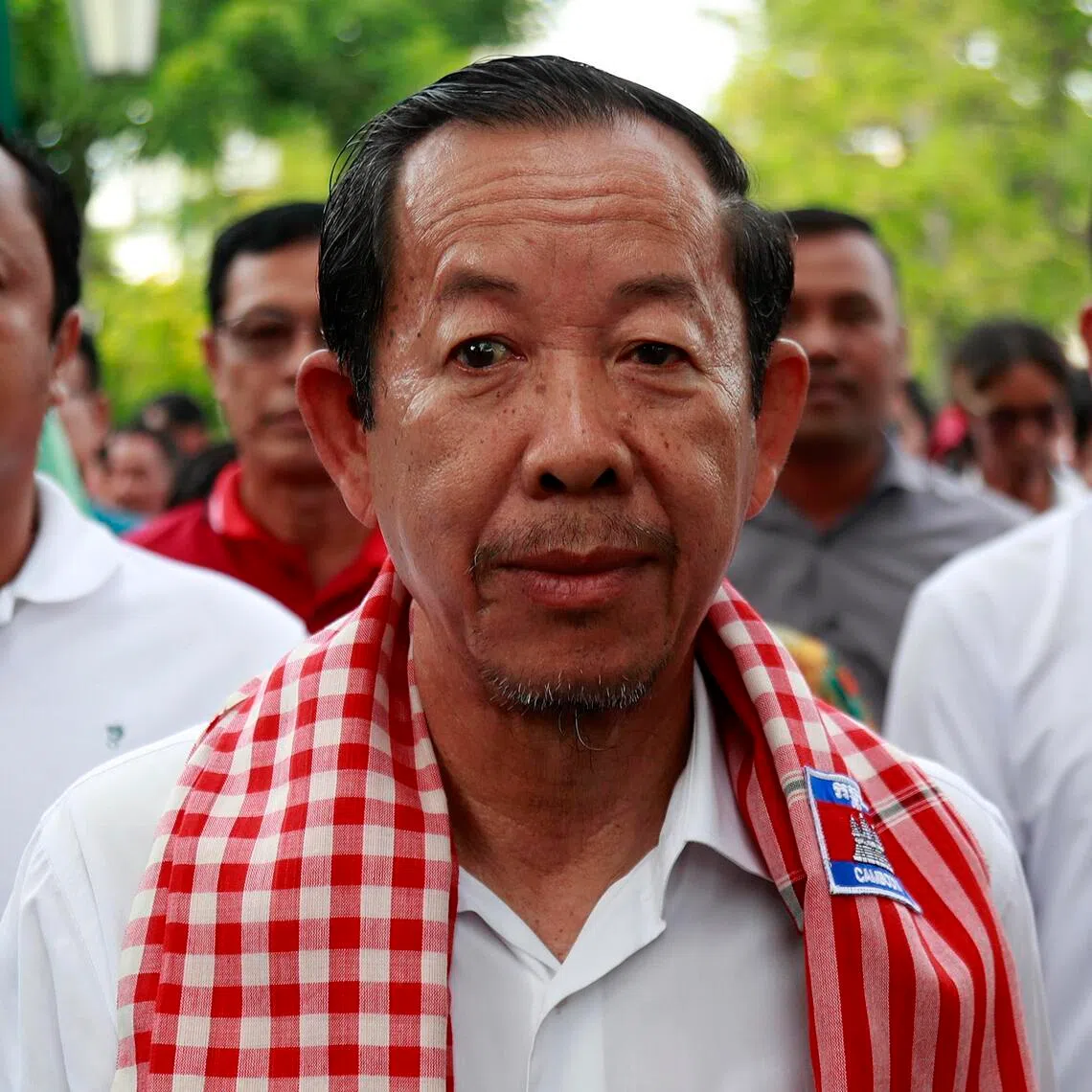 Rong Chhun (centre) was sentenced to four years in jail in 2025 for incitement to cause social unrest.