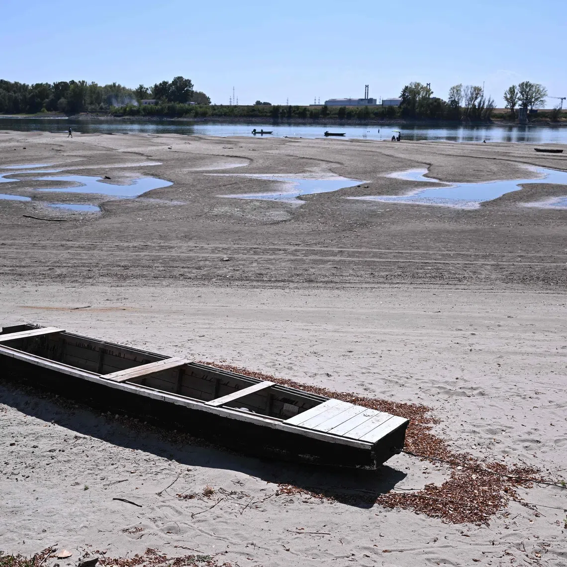 A view of the dried-up Danube riverbed with the Paks power plant in the background, near Dunaszentbenedek, close to Paks town, on July 31.