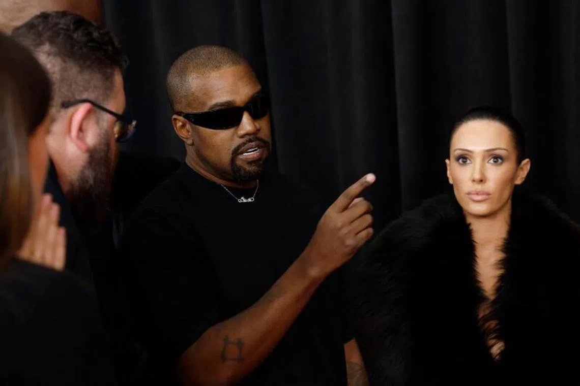 Rapper Kanye West, also known as Ye (left), with his wife Bianca Censori (right) attend the 67th Grammy Awards on Feb 2, 2025 in Los Angeles, California. 