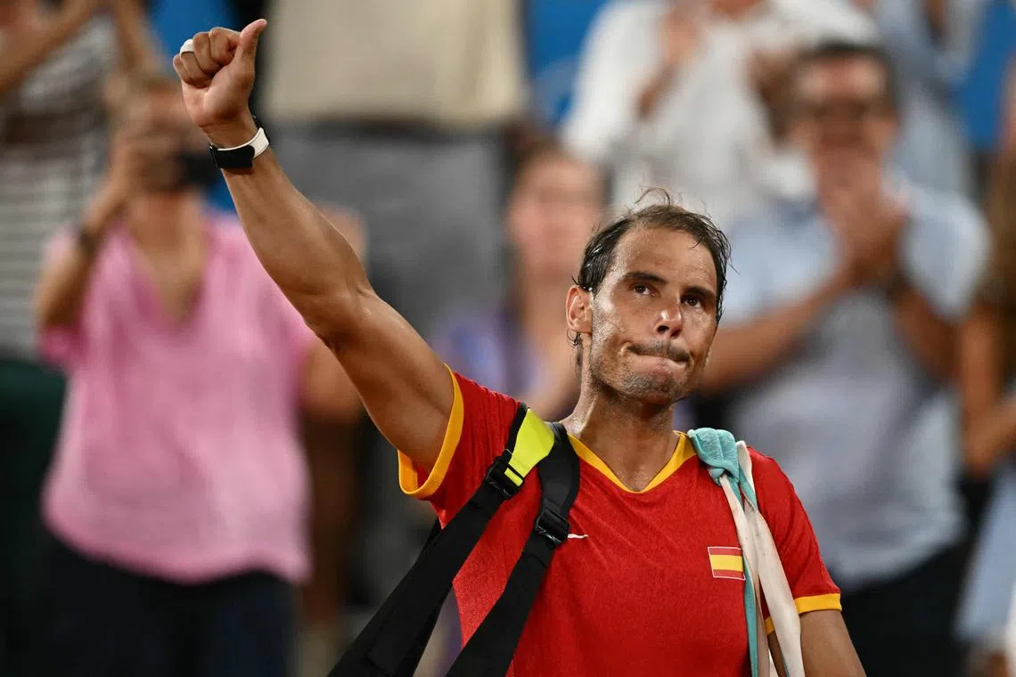 Spain's Rafael Nadal waves goodbye after losing in the quarter-finals of the men's Olympic doubles, with compatriot Carlos Alcaraz, in July 2024.