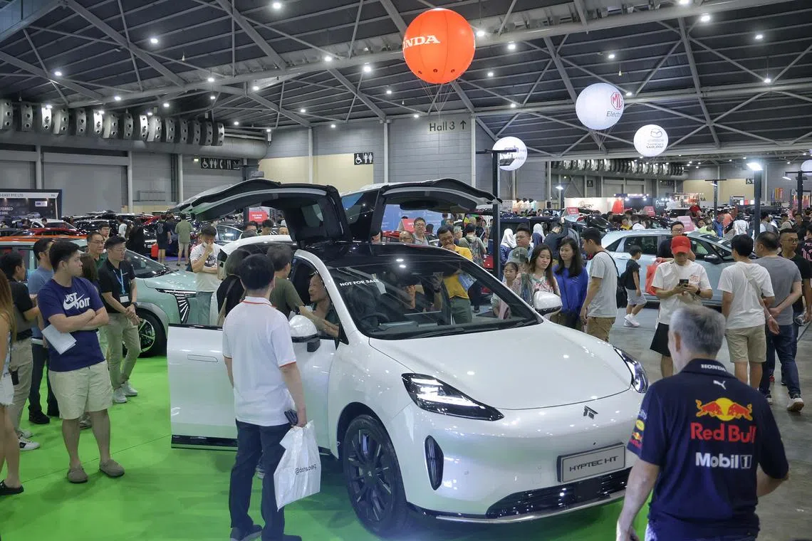 Visitors viewing the Aion Hyptec HT at the Car Expo on Oct 5.