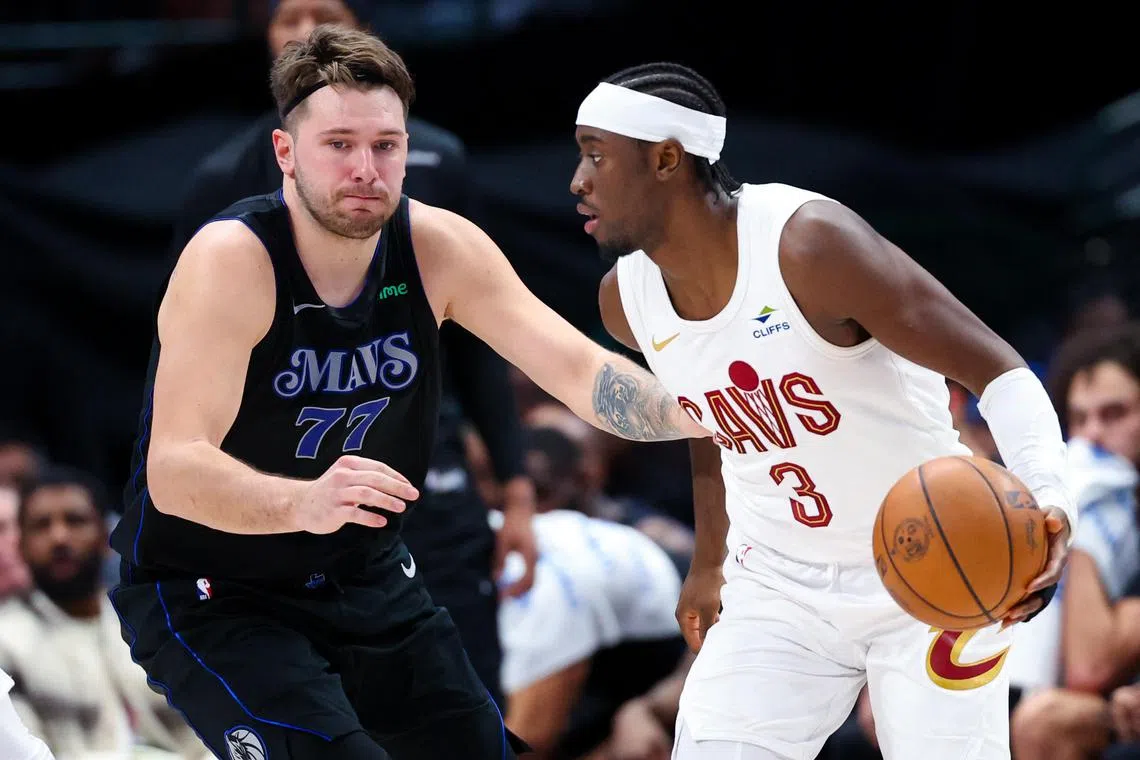 Cleveland Cavaliers guard Caris LeVert controls the ball as Dallas Mavericks guard Luka Doncic defends during the second half at American Airlines Centre.