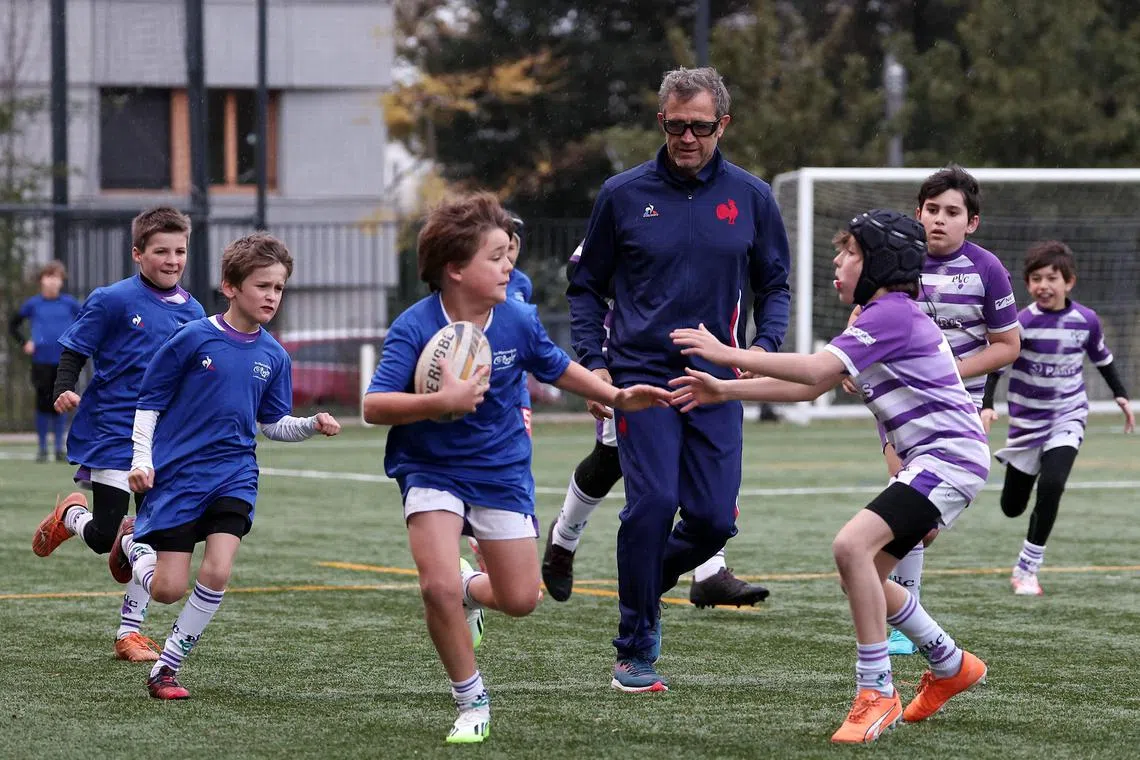 France head coach Fabien Galthie during a training session with children ahead of a press conference.