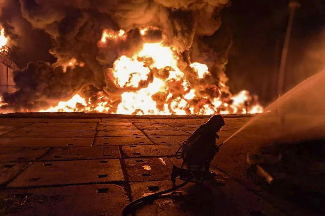 epa12311820 A handout photo provided by the State Emergency Service shows Ukrainian rescuers working at the site of a Russian strike on an infrastructure facility near Odesa, Ukraine, 18 August 2025 (issued 20 August 2025), amid the ongoing Russian invasion. At least one person was injured in a large fire at a fuel and energy infrastructure site, according to the State Emergency Service.  EPA/STATE EMERGENCY SERVICE HANDOUT HANDOUT HANDOUT EDITORIAL USE ONLY/NO SALES