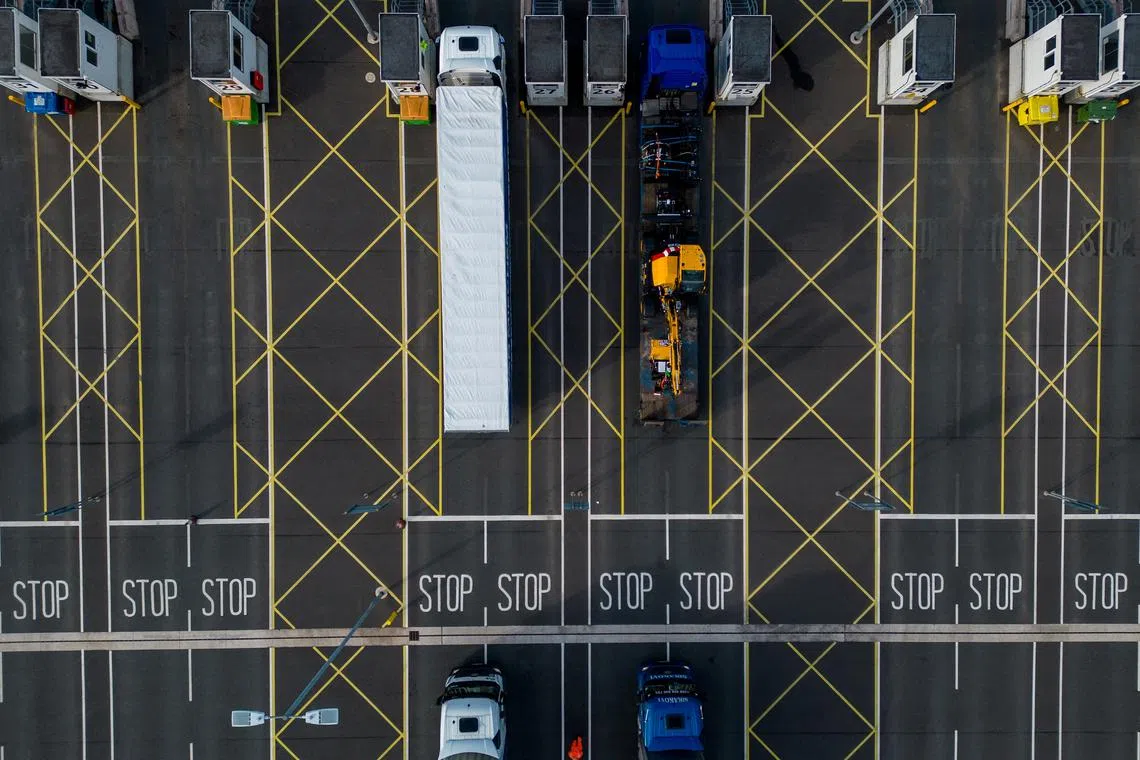 FILE PHOTO: A drone view shows cargo lorries processing through the Sevington Inland Border Facility near Ashford, Britain, April, 30, 2024. REUTERS/Chris J. Ratcliffe/File Photo