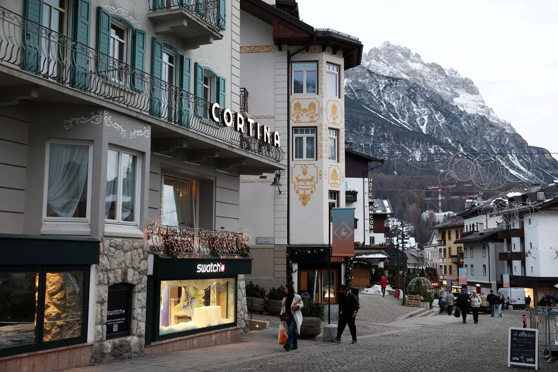 FILE PHOTO: People walk along a shopping street in downtown Cortina d'Ampezzo ahead of Milano Cortina Winter Olympic Games 2026, in Cortina d’Ampezzo, Italy, December 4, 2025. REUTERS/Claudia Greco/File Photo