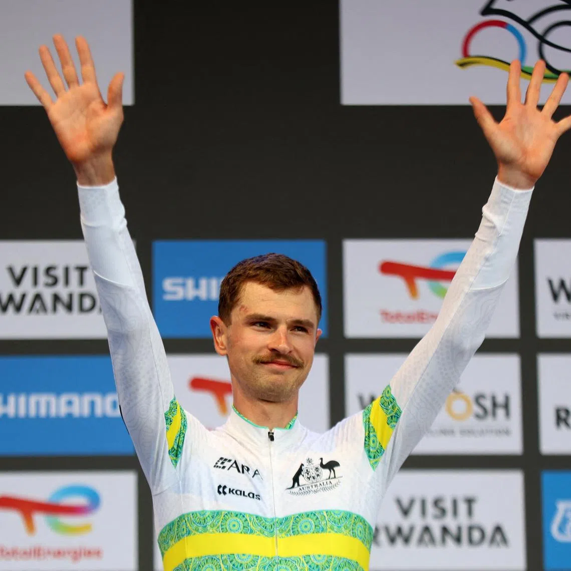 Cycling - Road World Championships 2025 - Kigali, Rwanda - September 21, 2025 Silver medallist Australia's Jay Vine celebrates on the podium after the Men's Elite Individual Time Trial REUTERS/Jean Bizimana