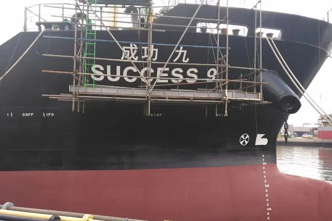 The Success 9 is described as a “black-hulled tanker with a white superstructure, (and a) white funnel with blue stripes”.