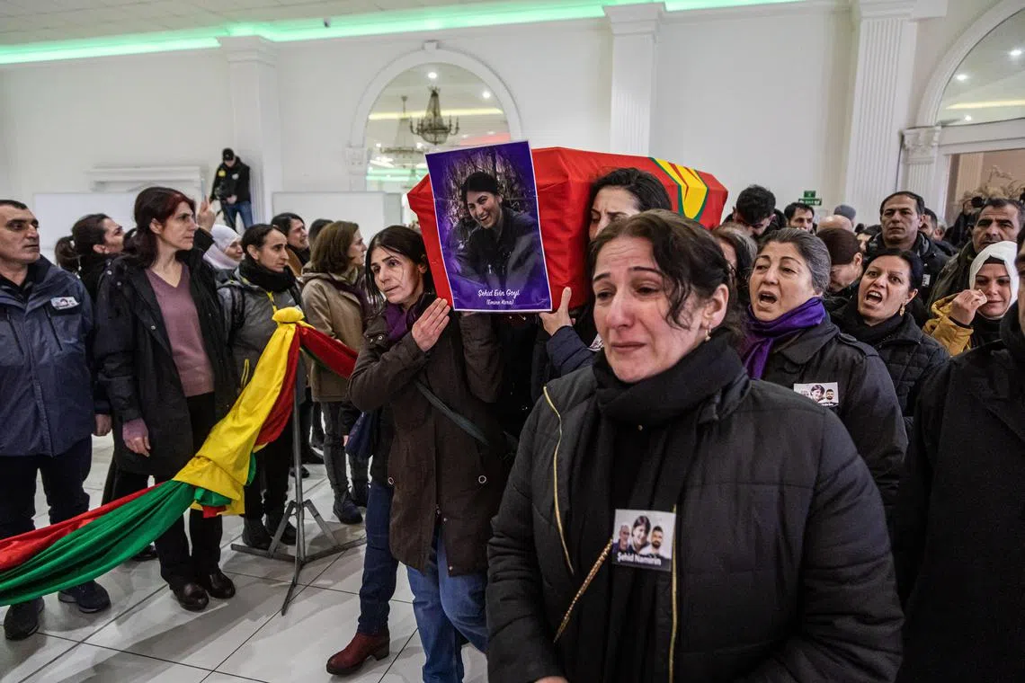 Members of the Kurdish community carry the coffin of Emine Kara during a funeral ceremony in Villiers-le-Bel, France, 03 January 2023. The three Kurdish people Emine Kara, Mir Perwer and Abdulrahman Kizil  were killed after a gunman opened fire outside a Kurdish cultural center in central Paris on 23 December.  EPA-EFE/CHRISTOPHE PETIT TESSON