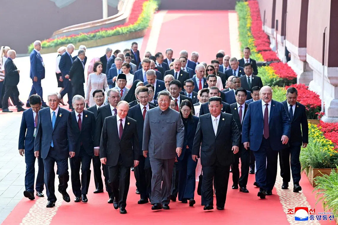 Chinese President Xi Jinping, flanked by Russian President Vladimir Putin and North Korean leader Kim Jong Un, leading world leaders in Beijing on Sept 3.