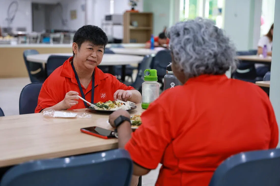 Ms Pang Jian Ting, a 34-year-old care assistant who has intellectual disability, interacting with a colleague during lunchtime at The Salvation Army’s Peacehaven Nursing Home. A new hub in Jurong West will help persons with disabilities find gainful employment