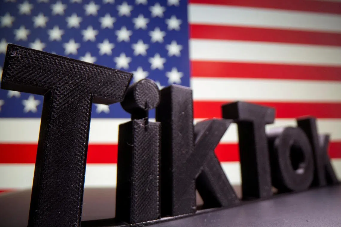 FILE PHOTO: A 3D printed Tik Tok logo is seen in front of U.S. flag in this illustration taken October 6, 2020. Picture taken October 6, 2020. REUTERS/Dado Ruvic/Illustration/File Photo