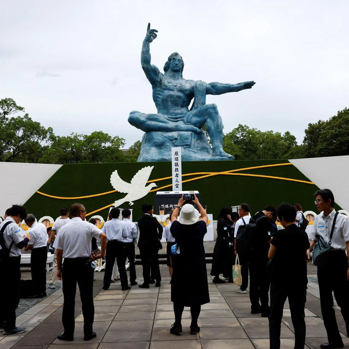 Attendees at the Nagasaki Peace Statue at a ceremony remembering the 81st anniversary of the bombing of Nagasaki, Japan, on Aug 9.