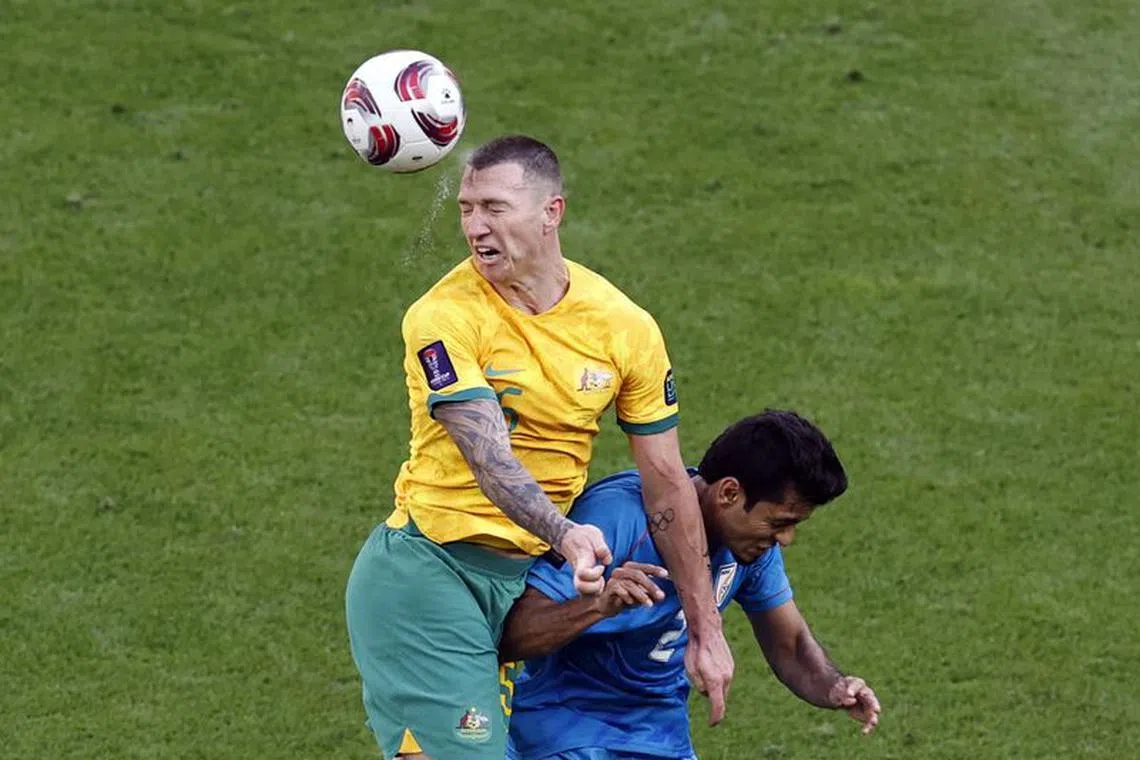 FILE PHOTO: Soccer Football - AFC Asian Cup - Group B - Australia v India - Ahmad bin Ali Stadium, Al Rayyan, Qatar - January 13, 2024  Australia's Mitchell Duke in action with India's Rahul Bheke REUTERS/Thaier Al-Sudani/File Photo