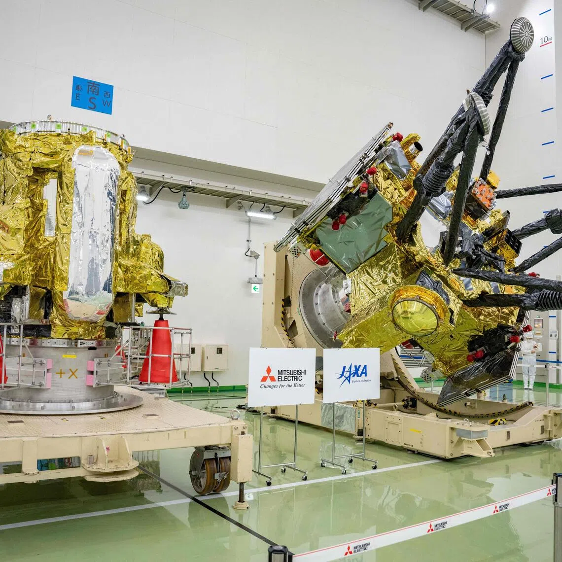 A Propulsion Module (left) and Exploration and Return Modules, making up the Martian Moons eXploration (MMX) spacecraft, at the Tanegashima Space Center in Minamitane, Kagoshima prefecture, on Aug 13.