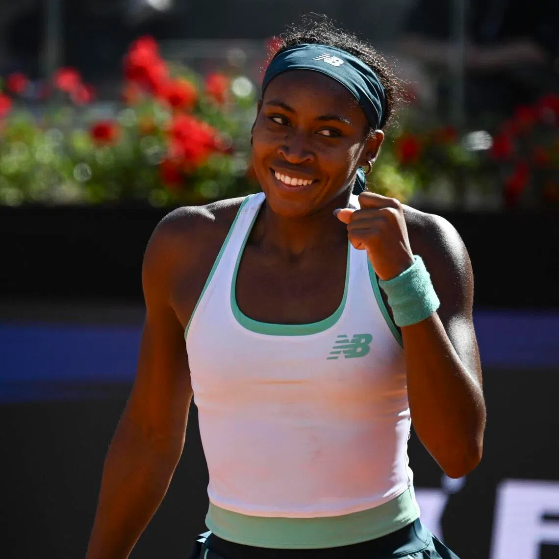 Coco Gauff, of the US, celebrates her May 14 win against Romania's Sorana Cirstea.