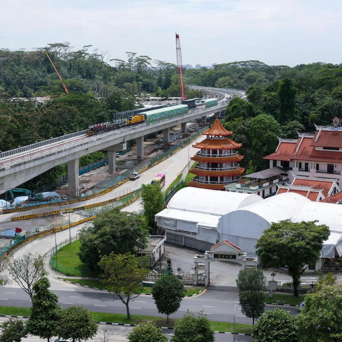 ST20260226_202680200765/Jasel Poh/vcrail04

Photo of a section of track between JS2 Choa Chu Kang West Station and JS2A Station with Hai Inn Temple in the foreground on Feb 26, 2026.