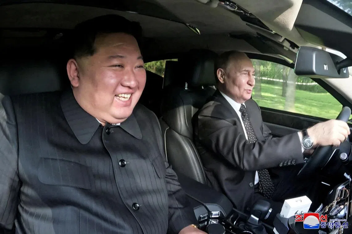 Russian President Vladimir Putin and North Korean leader Kim Jong Un ride an Aurus car in Pyongyang, North Korea on June 20.