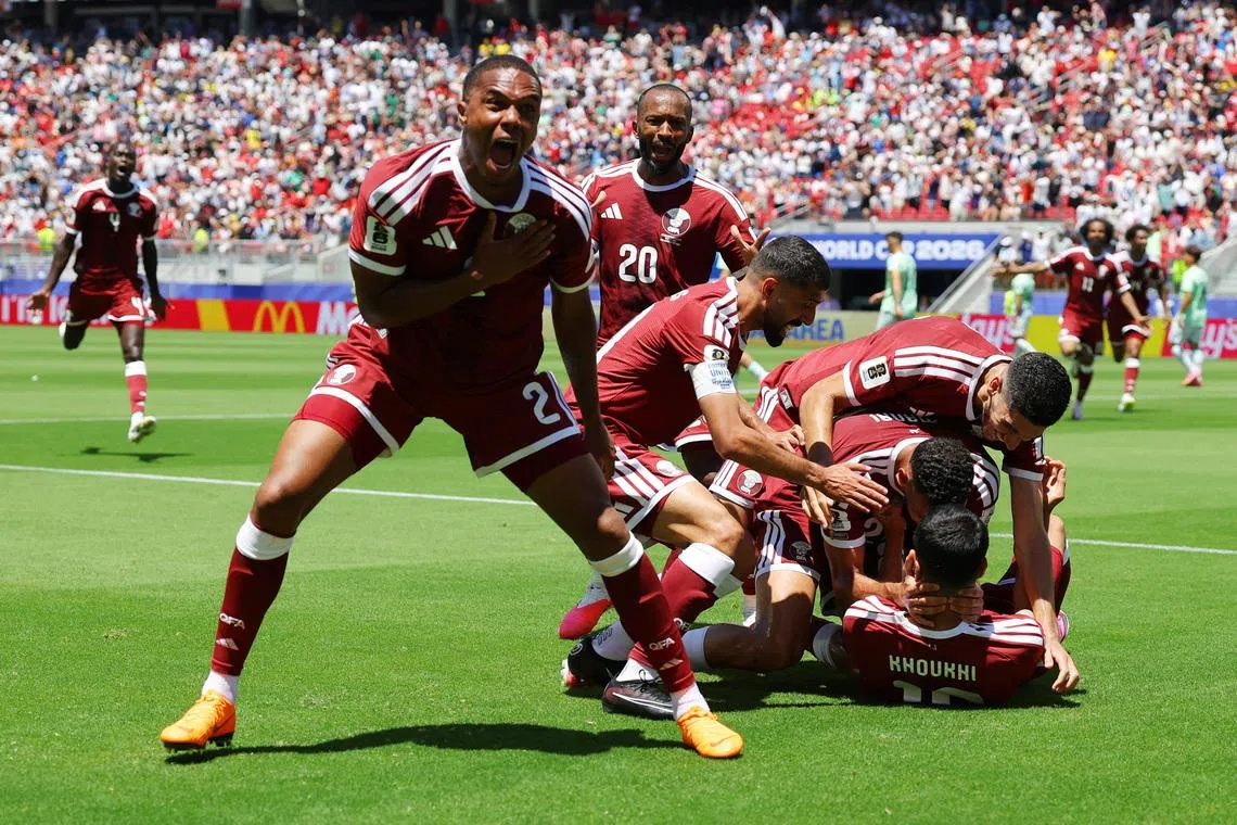 Soccer Football - FIFA World Cup 2026 - Group B - Qatar v Switzerland - San Francisco Bay Area Stadium, Santa Clara, California, U.S. - June 13, 2026 Qatar's Pedro Miguel celebrates after Boualem Khoukhi scored their first goal REUTERS/Carlos Barria