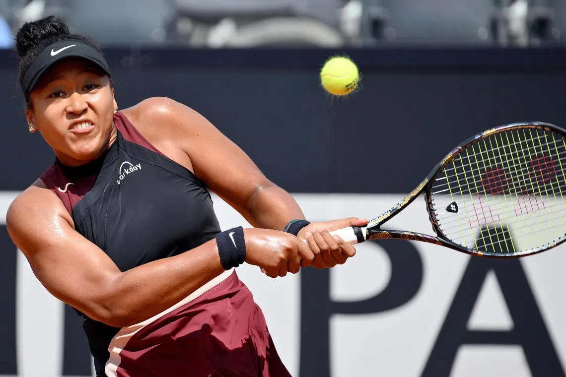 epa11336620 Naomi Osaka of Japan in action during her women's singles round of 16 match against Qinwen Zheng of China at the Italian Open tennis tournament in Rome, Italy, 13 May 2024.  EPA-EFE/ETTORE FERRARI