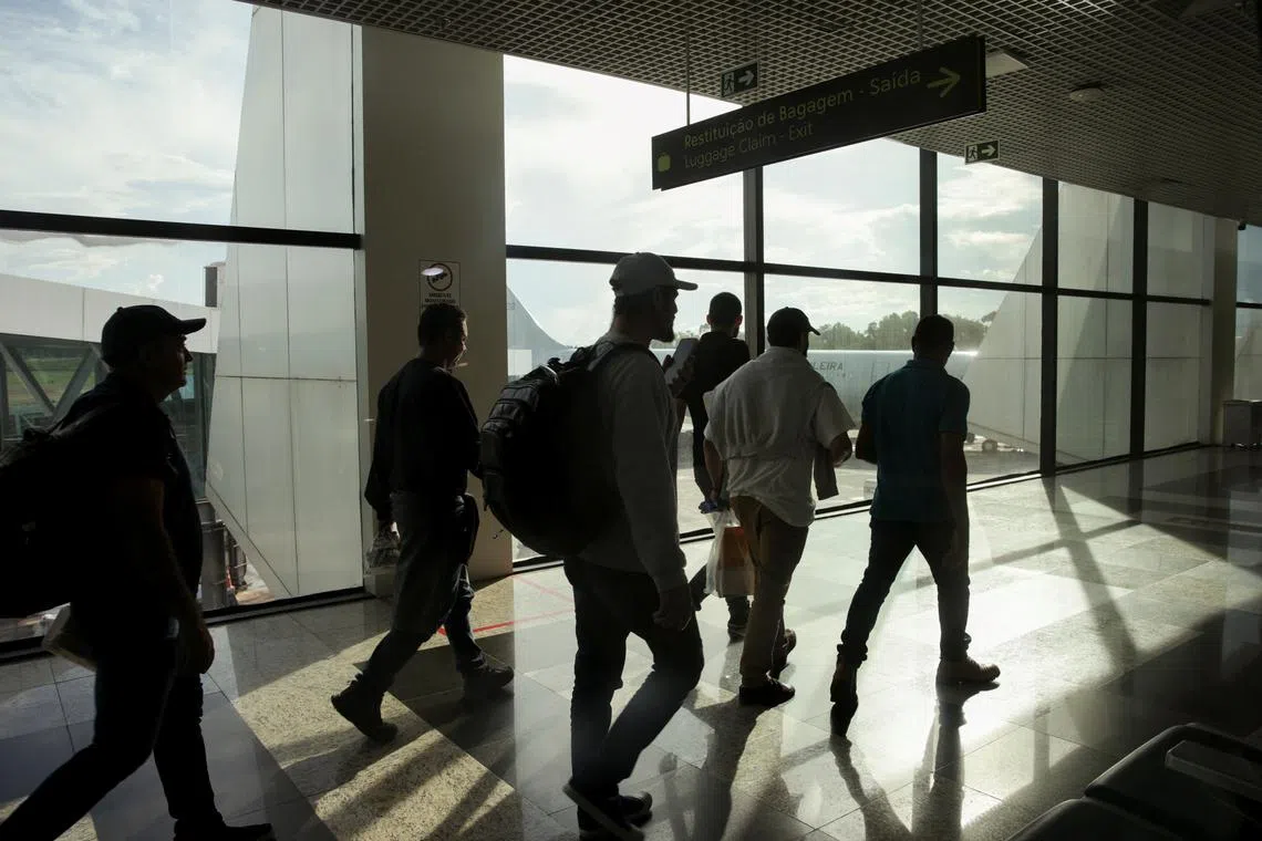 FILE PHOTO: Brazilian migrants deported from the U.S. under President Donald Trump's administration, board a Brazilian Air Force flight to Belo Horizonte at the Eduardo Gomes International Airport in Manaus, Brazil, January 25, 2025. REUTERS/Bruno Kelly/File Photo