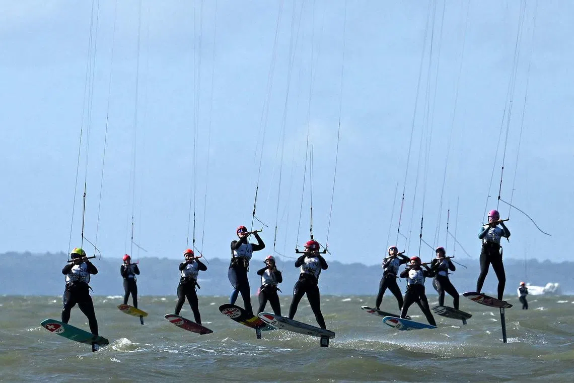 Competitors race during the final day of the Formula Kite European Championships, in Portsmouth, southern England, on September 24.