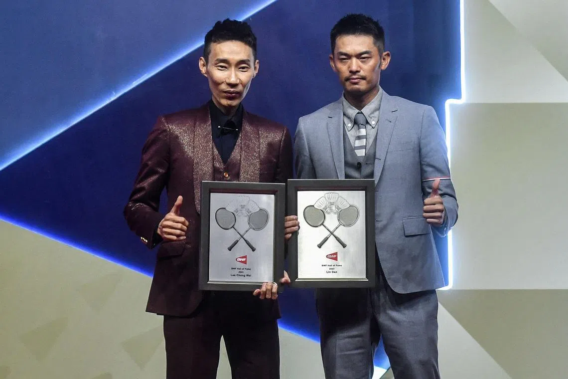 Malaysia's former world No. 1 badminton player Lee Chong Wei (left) and China's former world champion Lin Dan posing for photo before being inducted into the Badminton World Federation (BWF) Hall of Fame 2023, in Kuala Lumpur on May 26.