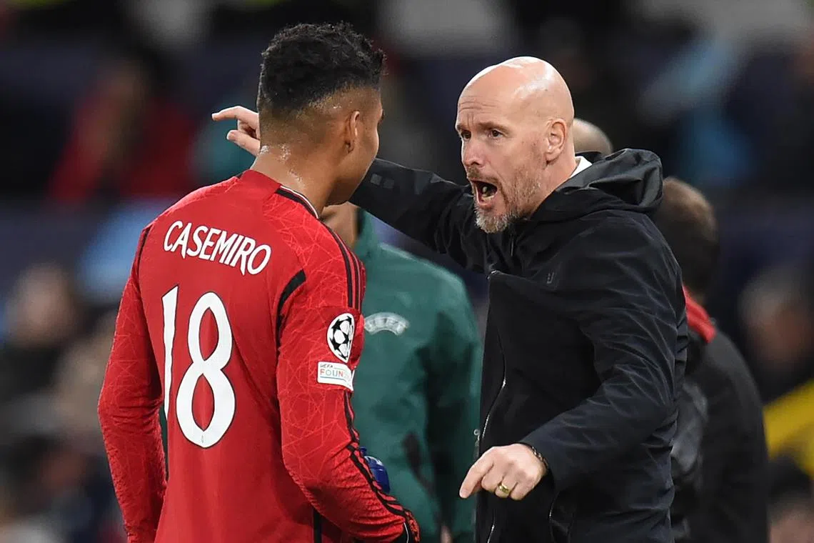 Manchester United manager Erik ten Hag speaks to midfielder Casemiro during the 3-2 Champions League defeat by Galatasaray.