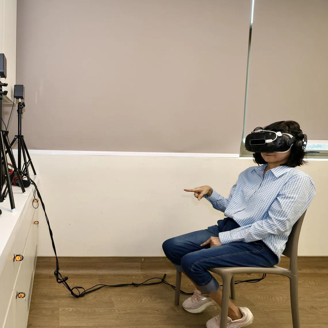 Housewife Goh Ai Lian, 61, trying out virtual reality based cognitive screening tool Cavire-2, at Eunos Polyclinic on Aug 5, 2025.