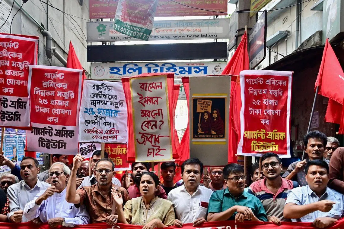Garment workers and activists take part in a protest in Dhaka on Nov 7, 2023.