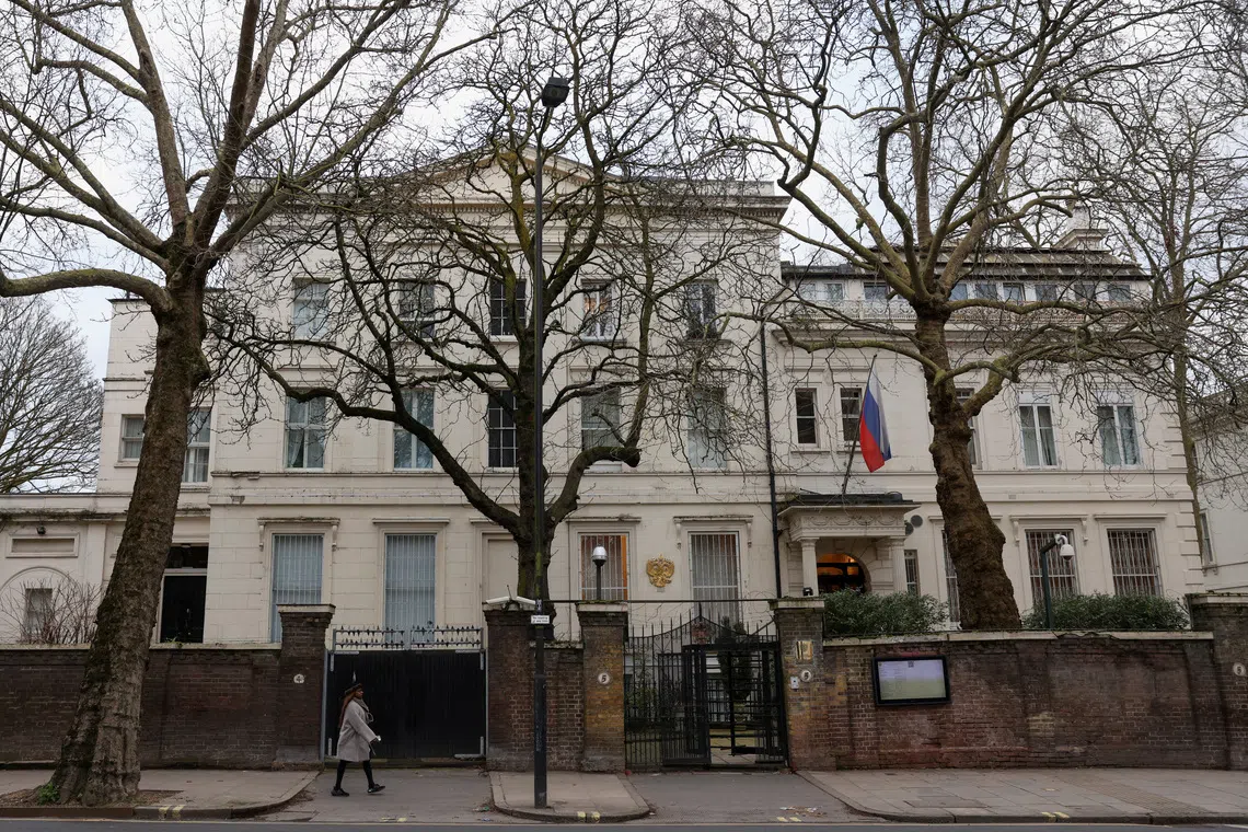 FILE PHOTO: A pedestrian walks past the Russian Embassy in London, Britain, February 16, 2024. REUTERS/Hollie Adams/File Photo