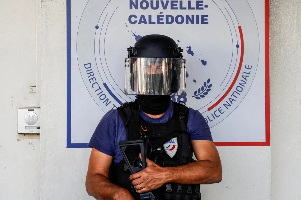 FILE PHOTO: A policeman waits for the arrival of French President Emmanuel Macron at the central police station in Noumea, France's Pacific territory of New Caledonia on May 23, 2024. LUDOVIC MARIN/Pool via REUTERS/File Photo