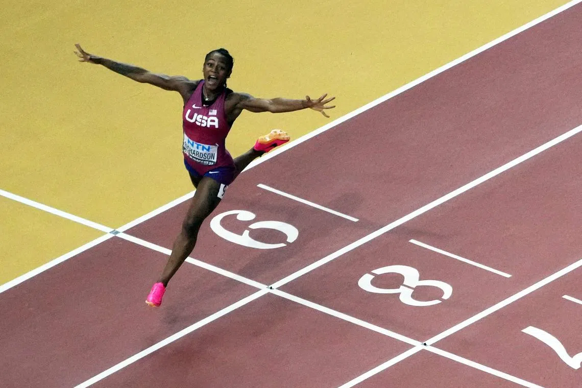 Sha'carri Richardson of the US crosses the line to win the women's 100m final.