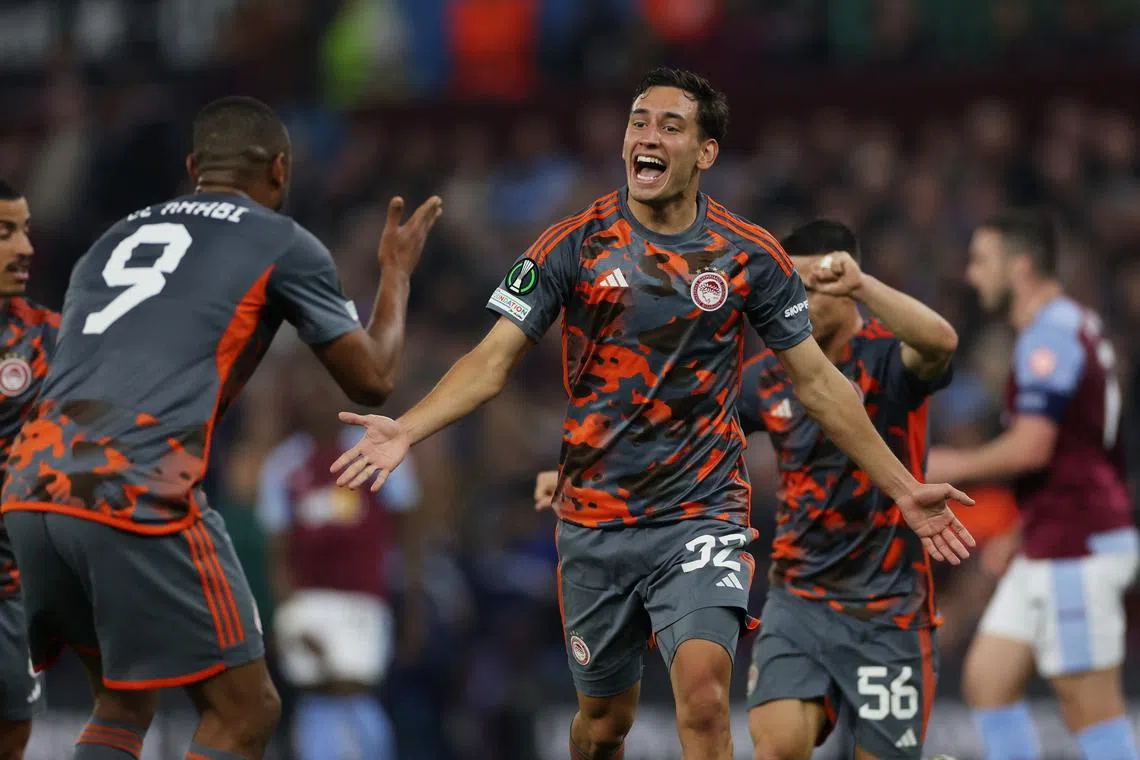 Soccer Football - Europa Conference League - Semi Final - First Leg - Aston Villa v Olympiacos - Villa Park, Birmingham, Britain - May 2, 2024  Olympiacos' Santiago Hezze celebrates scoring their fourth goal with Ayoub El Kaabi Action Images via Reuters/Paul Childs