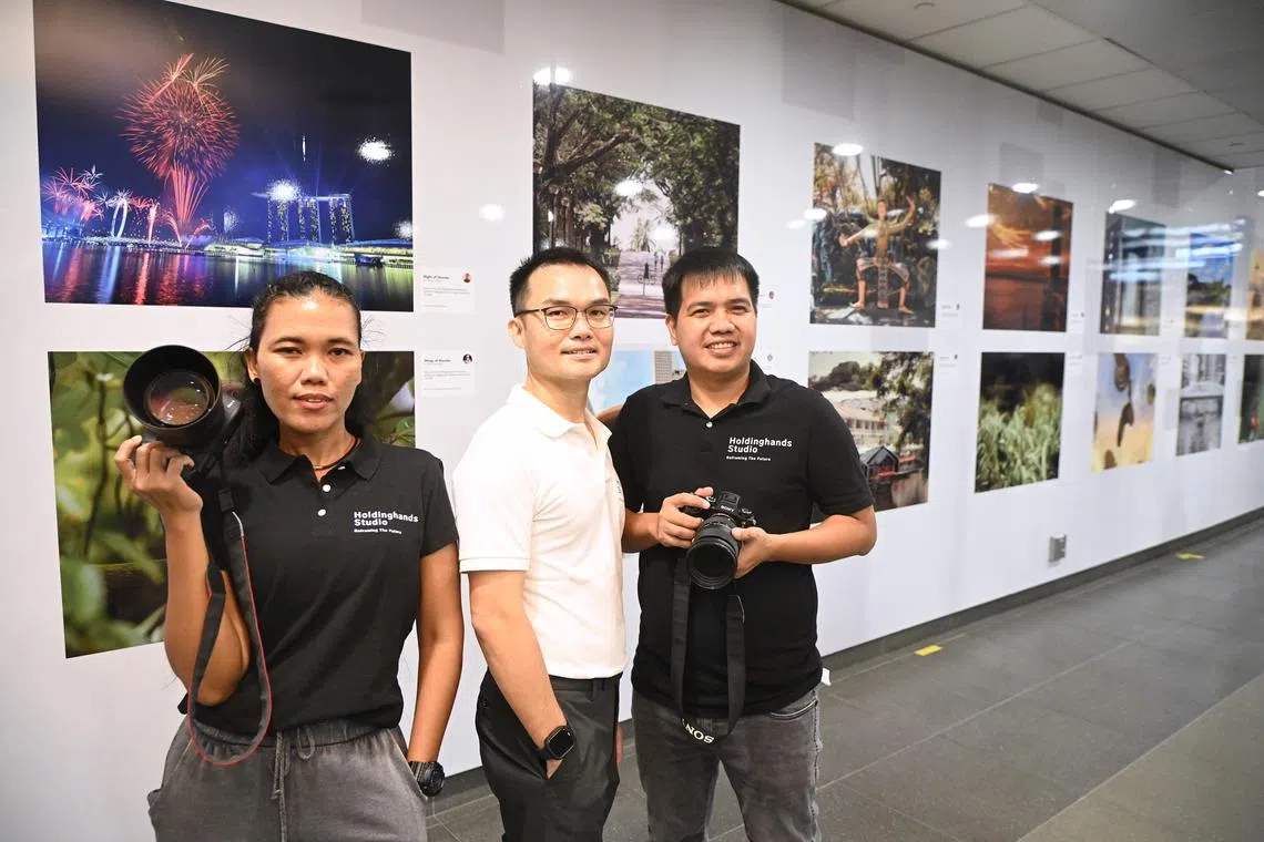 (From left) Ms Yuniarti, a domestic helper from Indonesia, Mr Tan Chin Hock, founder of Holdinghands Studio and Mr Hermie Benemerito from the Philippines.
