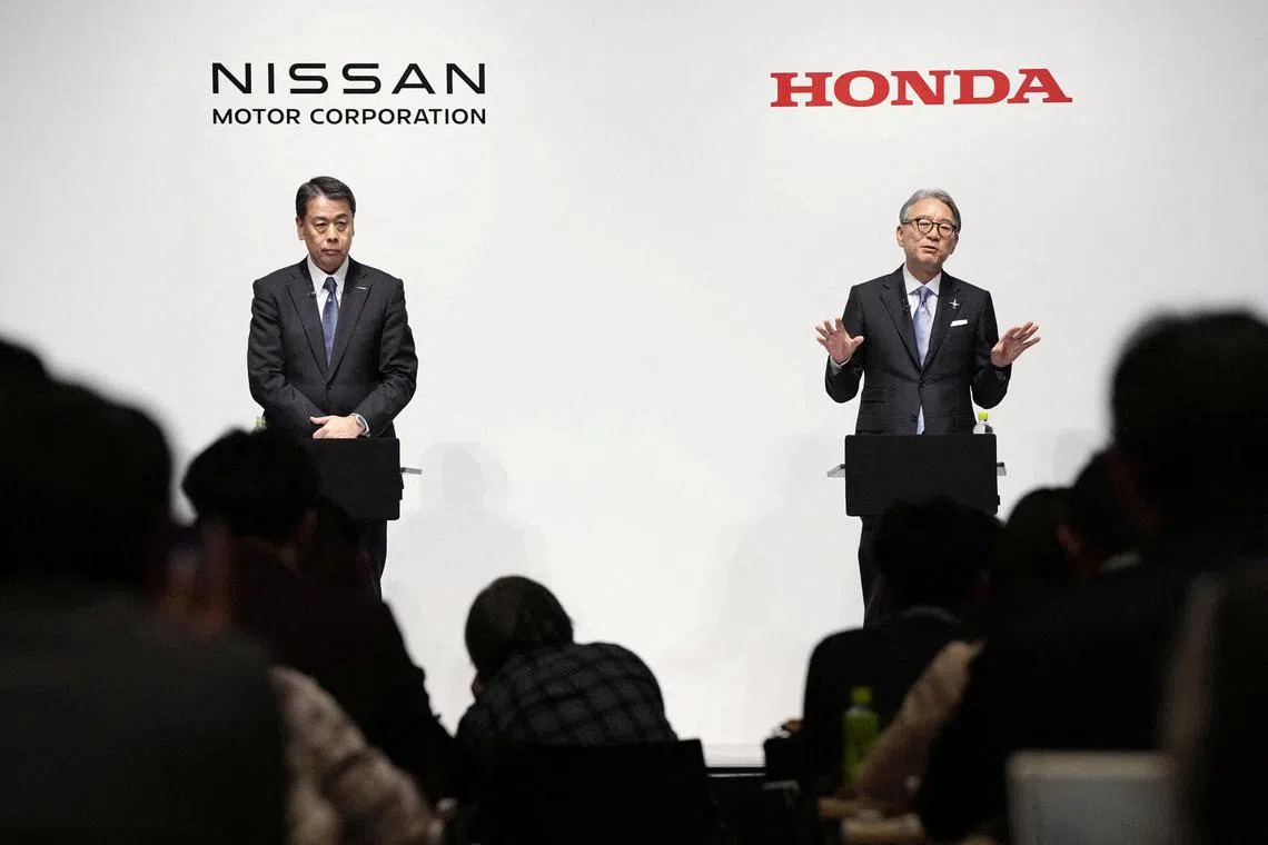 FILE PHOTO: Makoto Uchida, president and CEO of Nissan Motor, and Toshihiro Mibe, Honda Motor president and CEO, attend their joint press conference in Tokyo, Japan March 15, 2024. Mandatory credit Kyodo via REUTERS ATTENTION EDITORS - THIS IMAGE WAS PROVIDED BY A THIRD PARTY. MANDATORY CREDIT. JAPAN OUT. NO COMMERCIAL OR EDITORIAL SALES IN JAPAN/File Photo