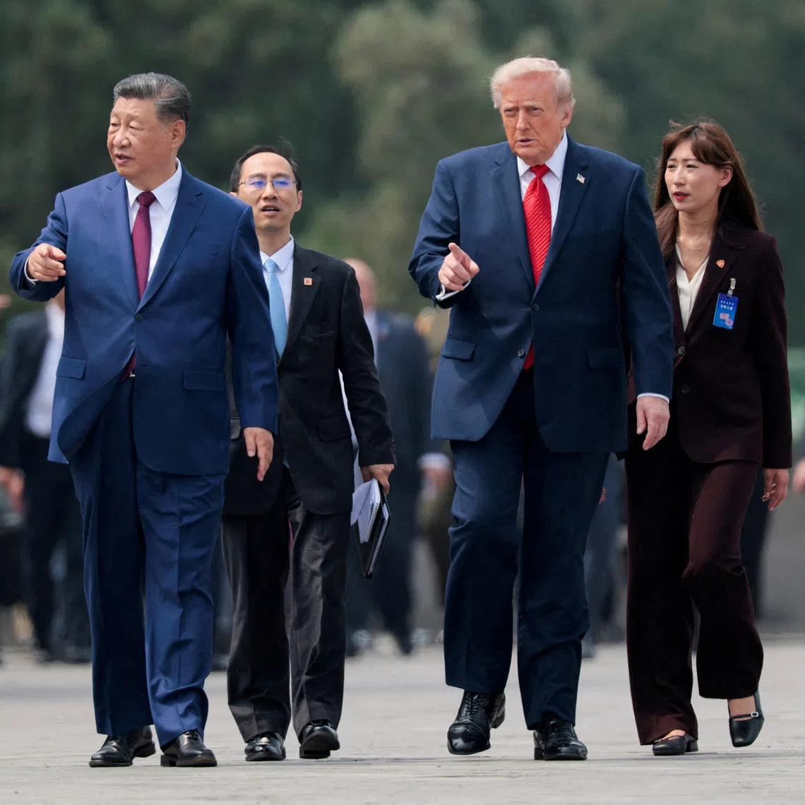 US President Donald Trump and Chinese President Xi Jinping walk together as they tour the Temple of Heaven in Beijing, China, on May 14.