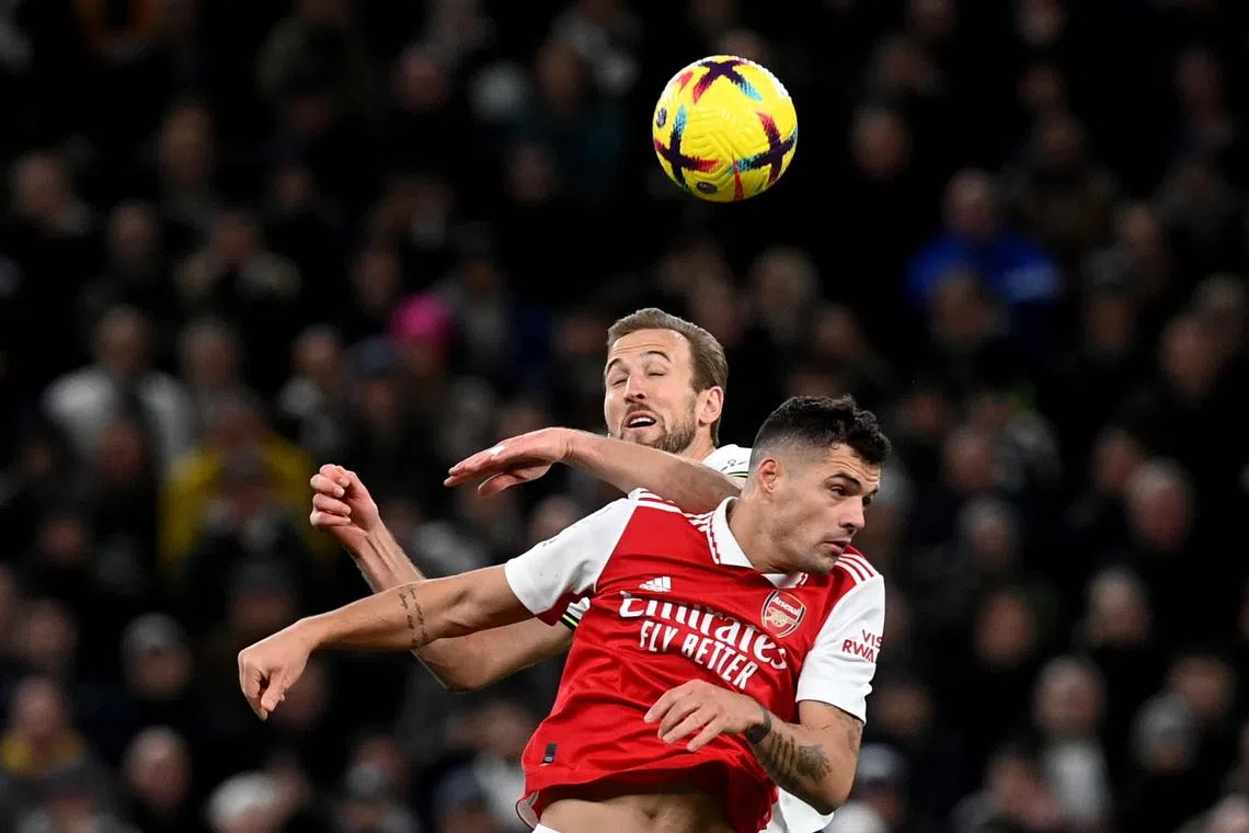 Tottenham's Harry Kane (left) in action against Granit Xhaka of Arsenal, during the match.