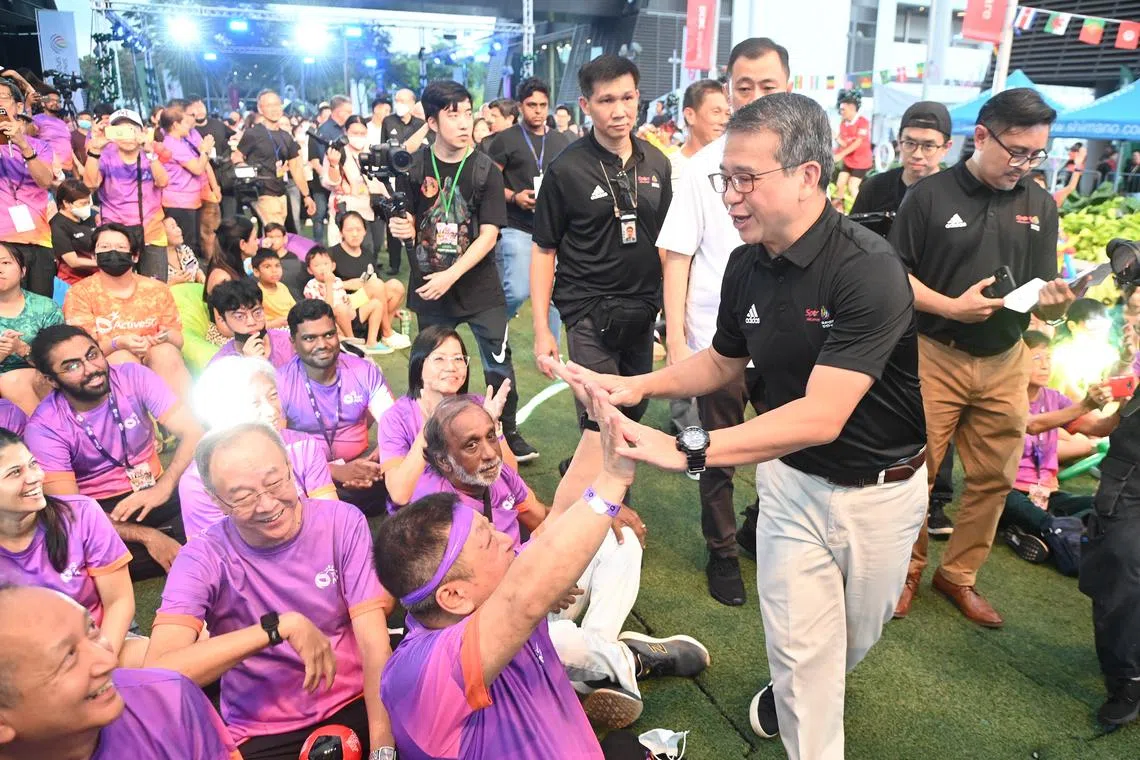 Edwin Tong, Minister for Culture, Community and Youth and Second Minister for Law Interacting with the public at OCBC Square on 9 December 2022.