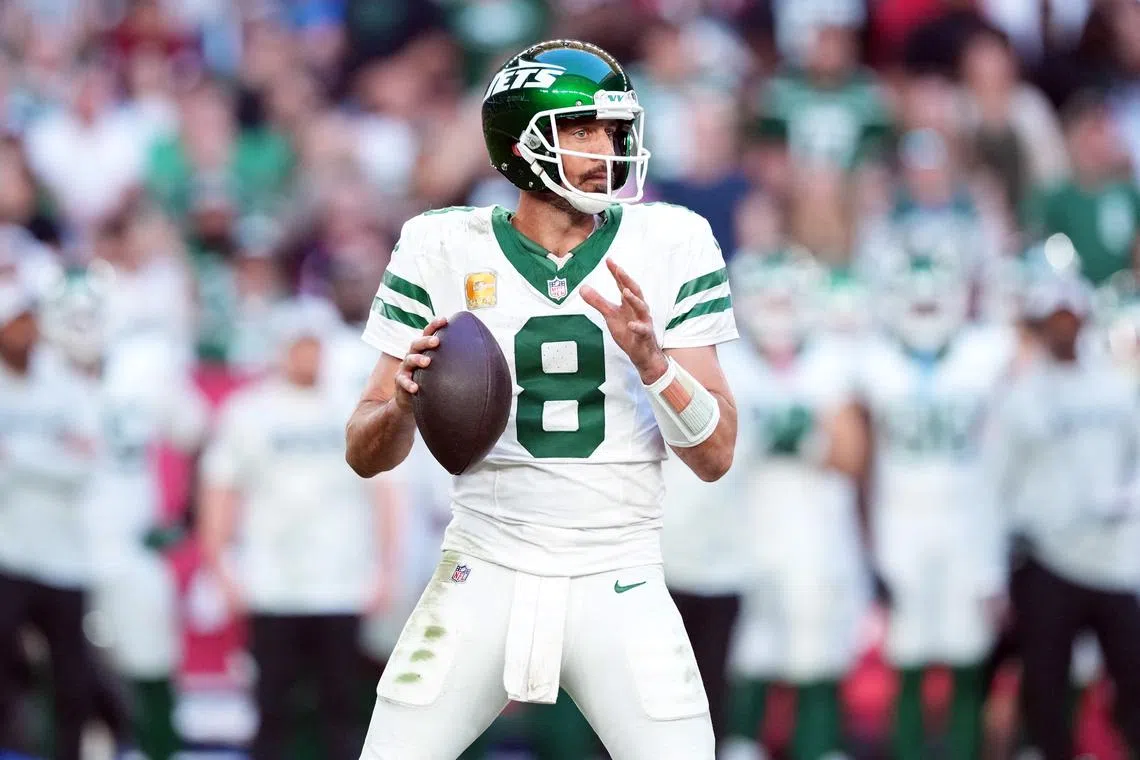 FILE PHOTO: Nov 10, 2024; Glendale, Arizona, USA; New York Jets quarterback Aaron Rodgers (8) passes against the Arizona Cardinals during the second half at State Farm Stadium. Mandatory Credit: Joe Camporeale-Imagn Images/File Photo