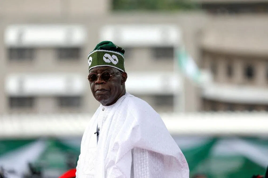 FILE PHOTO: Nigeria's President Bola Tinubu looks on after his swearing-in ceremony in Abuja, Nigeria May 29, 2023. REUTERS/Temilade Adelaja/File Photo