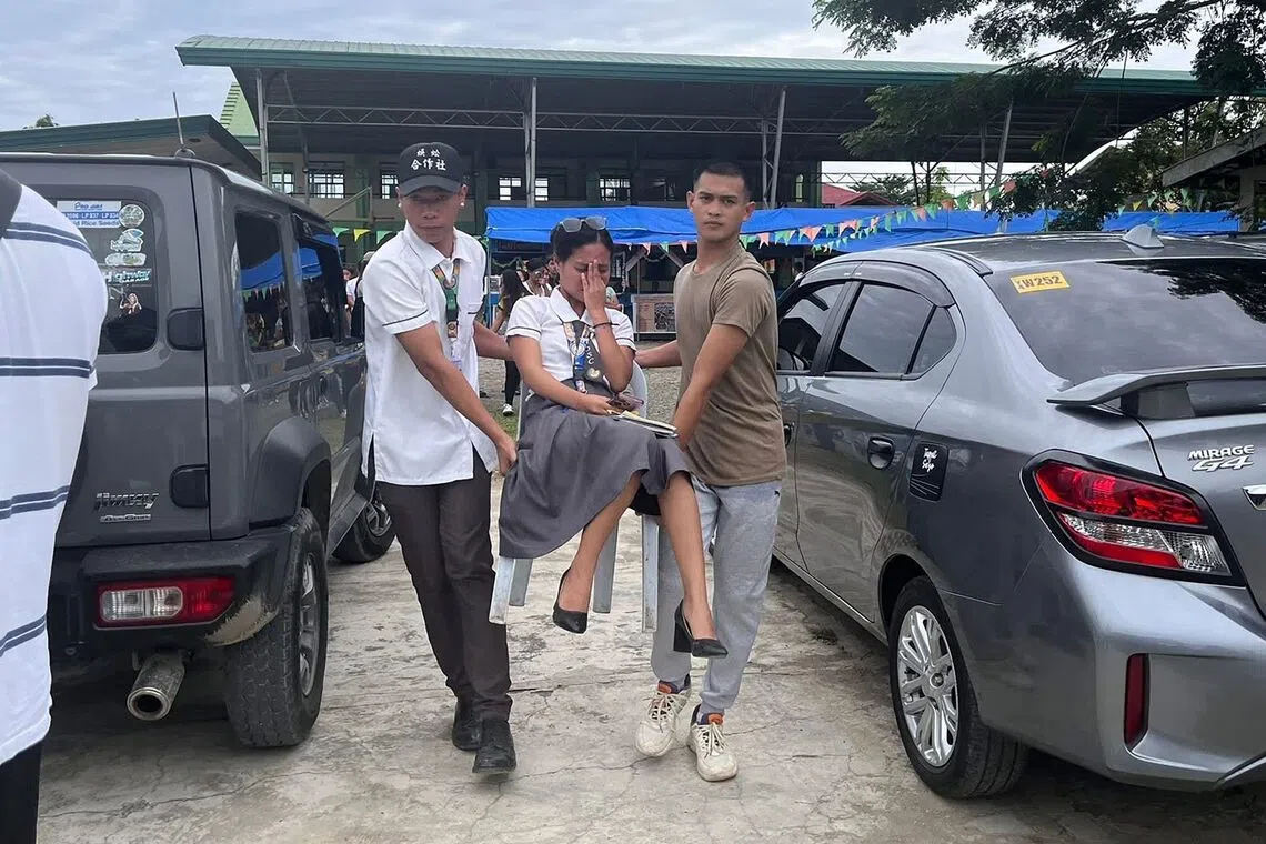 Students gathering outside the school buildings after an earthquake in Davao de Oro, Mindanao, on Oct 10, 2025 
A powerful magnitude-7.4 earthquake struck off the southern Philippines triggering warnings of a "destructive tsunami" on the country's Pacific coast within hours. 