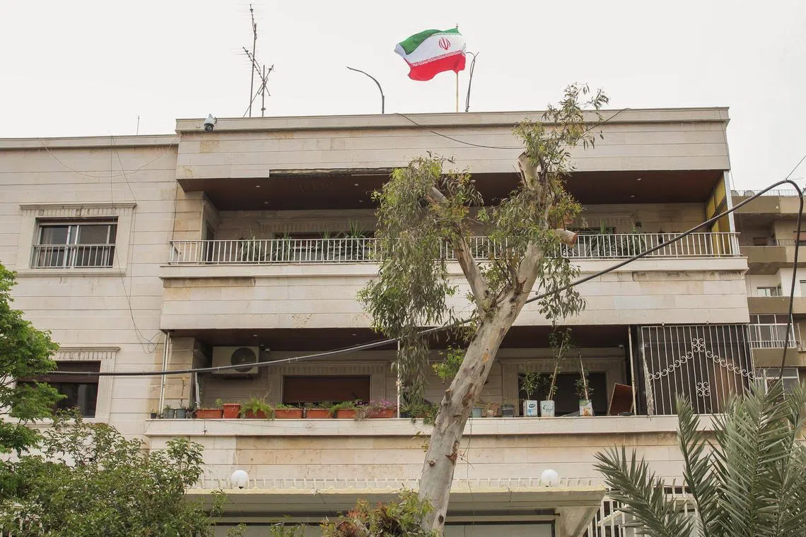 FILE PHOTO: Iranian flag flutters on new Iranian consulate building after Iran's consulate in Damascus was targeted in a suspected Israeli attack on Monday April 1, in Damascus, Syria April 8, 2024. REUTERS/Firas Makdesi/File Photo