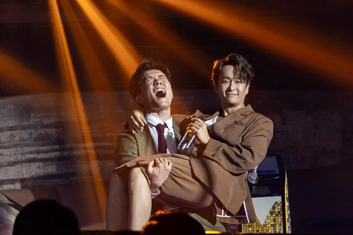 Zhang Zetong carries Jeremy Chan in his arms after All That Glitters wins Best Drama Serial on April 15, 2024.