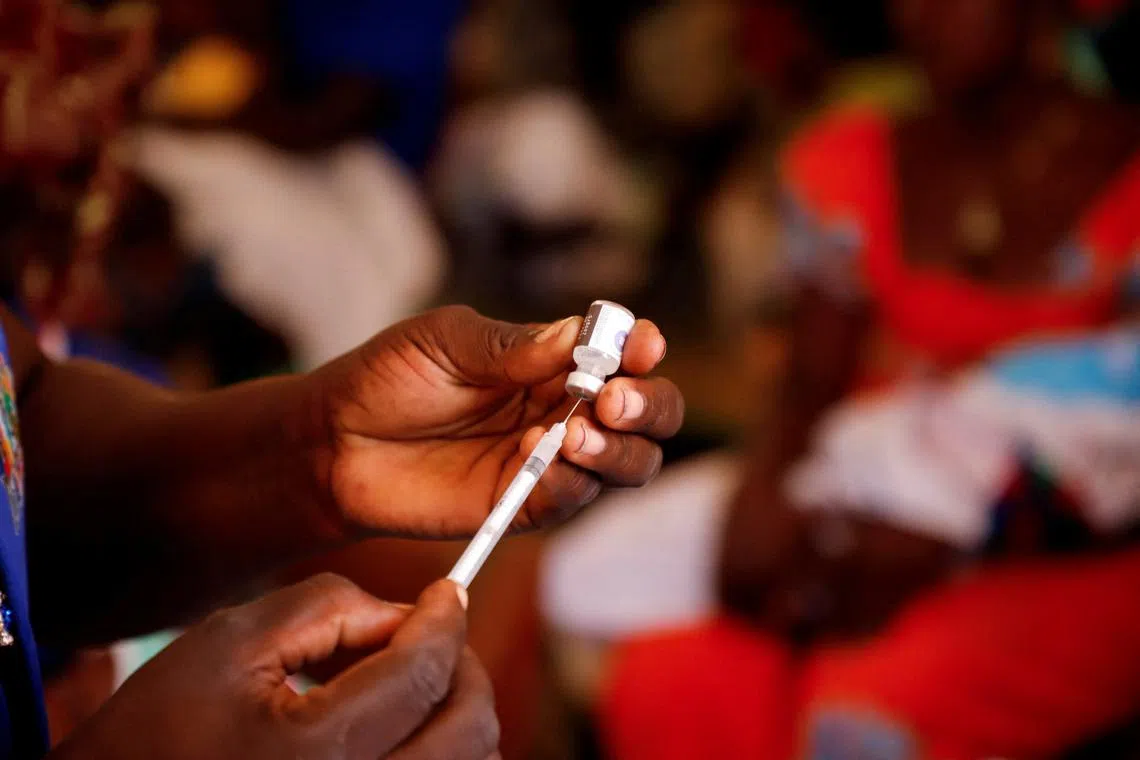 FILE PHOTO: A nurse prepares to administer a malaria vaccine to an infant at the health center in Datcheka, Cameroon January 22, 2024. REUTERS/Desire Danga Essigue/File Photo